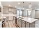 Modern kitchen with gray cabinets, quartz countertops, and stainless steel appliances at 4016 Cheyney Park Dr, Charlotte, NC 28269