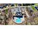 Aerial view of a community pool, playground, and clubhouse with parking and landscaping at 407 Blue Bay Ct, York, SC 29745