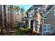 Home's exterior boasts a deck and wooded setting at 407 Blue Bay Ct, York, SC 29745