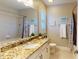 This bathroom features a granite countertop, a tub, and a shower at 407 Blue Bay Ct, York, SC 29745