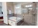 Modern bathroom featuring a glass-enclosed shower and a separate soaking tub at 407 Blue Bay Ct, York, SC 29745