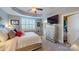 This bedroom features a tray ceiling, shutters and a large dresser at 407 Blue Bay Ct, York, SC 29745