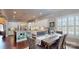 Elegant dining room with modern fixtures, lots of natural light, and wooden floors at 407 Blue Bay Ct, York, SC 29745