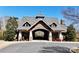 Exterior of a community building showing an entrance archway and meticulously maintained landscaping at 407 Blue Bay Ct, York, SC 29745
