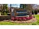 Community entrance featuring a stone Handsmill sign with a waterfall feature surrounded by lush landscaping at 407 Blue Bay Ct, York, SC 29745