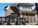 Exterior view of a brick home featuring a screened porch and a wooden deck with an outdoor grill at 407 Blue Bay Ct, York, SC 29745