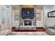 Elegant stone fireplace flanked by custom built-in shelves, adding warmth and character to the room at 407 Blue Bay Ct, York, SC 29745