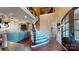 Grand foyer with wood floors, staircase, and view into the living room with a stone fireplace at 407 Blue Bay Ct, York, SC 29745