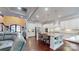 Bright, open kitchen with sleek white cabinets, a large island with seating, and hardwood flooring at 407 Blue Bay Ct, York, SC 29745