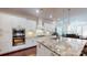 Gourmet kitchen featuring white cabinetry, granite countertops, stainless steel appliances, and a central island at 407 Blue Bay Ct, York, SC 29745