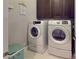 Functional laundry room with side-by-side washer and dryer, cabinets and linen closet at 407 Blue Bay Ct, York, SC 29745