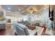 Spacious living room with coffered ceilings, a stone fireplace, large windows, and hardwood floors at 407 Blue Bay Ct, York, SC 29745