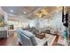 Open-concept living room featuring hardwood floors, coffered ceiling, and seamless flow to the modern kitchen at 407 Blue Bay Ct, York, SC 29745