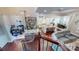 An open layout showcasing the kitchen, dining, and living areas with hardwood floors and stylish furnishings at 407 Blue Bay Ct, York, SC 29745