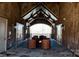 Inviting interior lounge with stone walls, wood beams, and rustic seating arrangement at 407 Blue Bay Ct, York, SC 29745