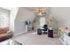 This cozy office includes a ceiling fan, a large window, and a dark wood desk at 407 Blue Bay Ct, York, SC 29745