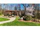 Community park featuring a covered pergola, stone fireplace, and lush landscaping for relaxation and enjoyment at 407 Blue Bay Ct, York, SC 29745