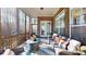 Comfortable screened porch with brick accents and outdoor seating area at 407 Blue Bay Ct, York, SC 29745