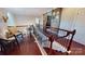 Elegant upstairs hallway with hardwood floors, a wrought-iron railing, and sliding wooden doors at 407 Blue Bay Ct, York, SC 29745