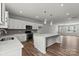 Modern kitchen with white cabinets, island, and stainless steel appliances at 4350 Reed Creek Dr, Sherrills Ford, NC 28673