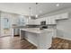 Modern kitchen with white cabinets, island, and stainless steel appliances at 4350 Reed Creek Dr, Sherrills Ford, NC 28673