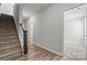 Modern staircase with dark wood railing and carpeted steps at 4350 Reed Creek Dr, Sherrills Ford, NC 28673