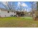 Large backyard with artificial turf and play area at 4618 New Town Rd, Waxhaw, NC 28173