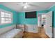 Bedroom with teal walls, wood floors, and access to outdoor space at 4618 New Town Rd, Waxhaw, NC 28173