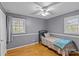 Bedroom with twin bed, hardwood floors, and ceiling fan at 4618 New Town Rd, Waxhaw, NC 28173