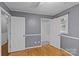 Bedroom with two doors and closet, hardwood floor at 4618 New Town Rd, Waxhaw, NC 28173