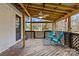 Relaxing covered patio with ceiling fan and seating at 4618 New Town Rd, Waxhaw, NC 28173