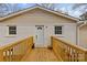 Back exterior with wooden deck and access door at 4618 New Town Rd, Waxhaw, NC 28173