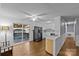 Bright kitchen with white cabinets, stainless steel appliances, and wood floors at 4618 New Town Rd, Waxhaw, NC 28173