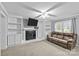 Living room with fireplace and built-in shelving at 4618 New Town Rd, Waxhaw, NC 28173