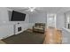 Living room featuring electric fireplace and wood floors at 4618 New Town Rd, Waxhaw, NC 28173