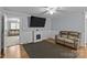 Living room with electric fireplace and brown couch at 4618 New Town Rd, Waxhaw, NC 28173