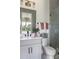 Modern bathroom with gray vanity, shower, and white toilet at 504 Meadow Ridge Dr, Belmont, NC 28012