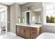 Bathroom with wood vanity, white countertop, and marble floors at 504 Meadow Ridge Dr, Belmont, NC 28012