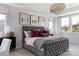 Elegant bedroom with a gray upholstered bed and accent pillows at 504 Meadow Ridge Dr, Belmont, NC 28012