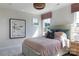 Serene bedroom featuring a queen bed and light pink color palette at 504 Meadow Ridge Dr, Belmont, NC 28012