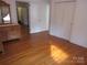 Bright bedroom features hardwood floors, white walls, and a closet at 515 N Pine Ln, Wadesboro, NC 28170