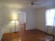 Bright living room features gleaming hardwood floors, white walls, and a classic design at 515 N Pine Ln, Wadesboro, NC 28170