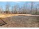 Large backyard with mature trees providing a private and wooded setting at 521 Summer Creek Dr, Stanley, NC 28164