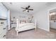 Main bedroom with white poster bed and en-suite bath at 521 Summer Creek Dr, Stanley, NC 28164