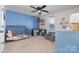 bedroom with blue accent wall and car theme at 521 Summer Creek Dr, Stanley, NC 28164