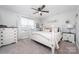 Main bedroom with white poster bed and neutral decor at 521 Summer Creek Dr, Stanley, NC 28164