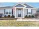 Gray house with a front porch and American flag at 521 Summer Creek Dr, Stanley, NC 28164