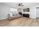 Living room with hardwood floors and a large TV at 521 Summer Creek Dr, Stanley, NC 28164