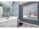 Clean bathroom, featuring a white vanity and a large mirror at 5681 Berry Ridge Dr, Harrisburg, NC 28075