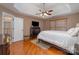 Bright bedroom with hardwood floors and ceiling fan at 5681 Berry Ridge Dr, Harrisburg, NC 28075